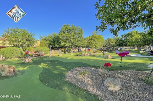 surrounding community featuring view of golf course