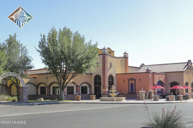 mediterranean / spanish home with stucco siding