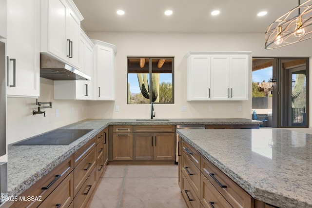 kitchen featuring black electric stovetop, under cabinet range hood, recessed lighting, a sink, and white cabinetry