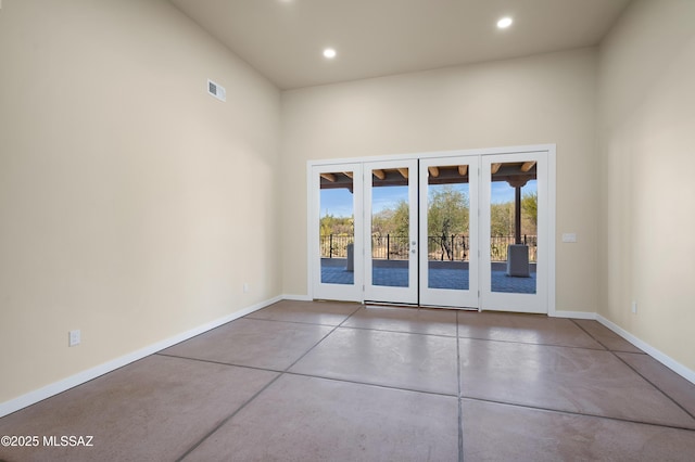 empty room with baseboards, concrete floors, visible vents, and recessed lighting