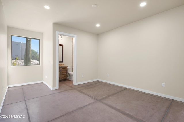 unfurnished bedroom with baseboards, connected bathroom, and recessed lighting