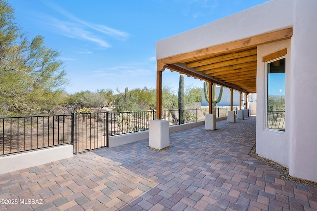 view of patio / terrace featuring fence