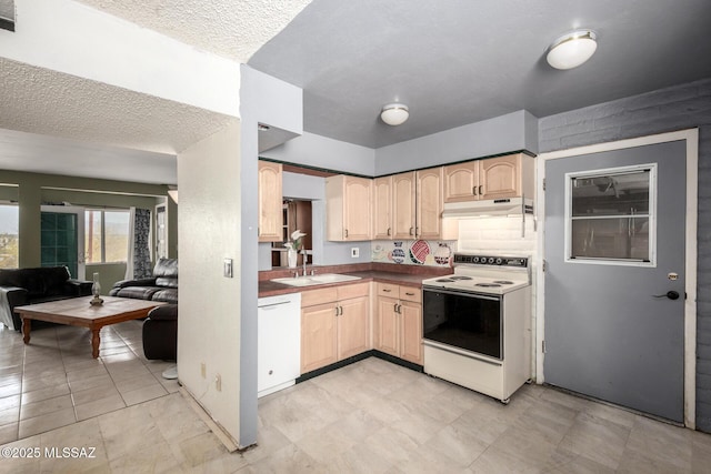 kitchen with light brown cabinetry, open floor plan, under cabinet range hood, white appliances, and a sink