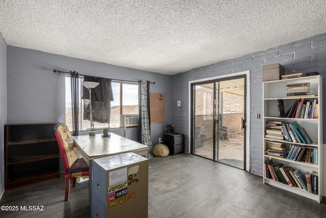 dining space featuring cooling unit, a textured ceiling, concrete flooring, and concrete block wall