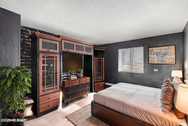 bedroom with light tile patterned flooring