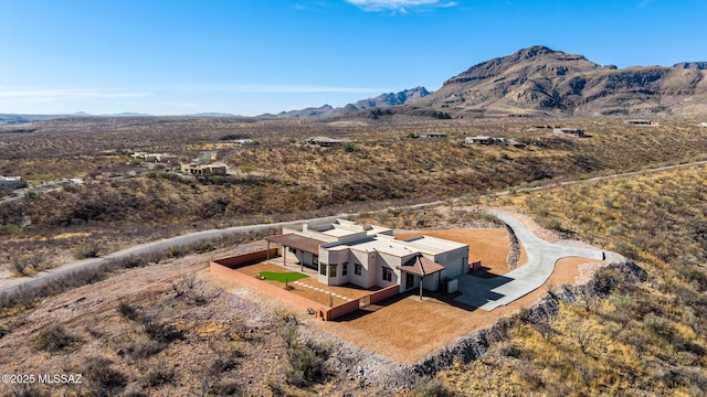 birds eye view of property featuring a mountain view