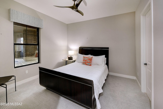 bedroom with ceiling fan, baseboards, and light colored carpet