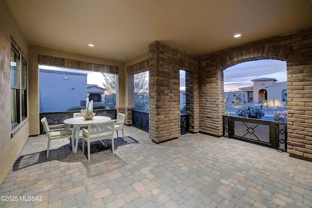 patio terrace at dusk with outdoor dining area