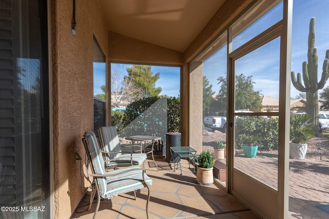 sunroom with lofted ceiling