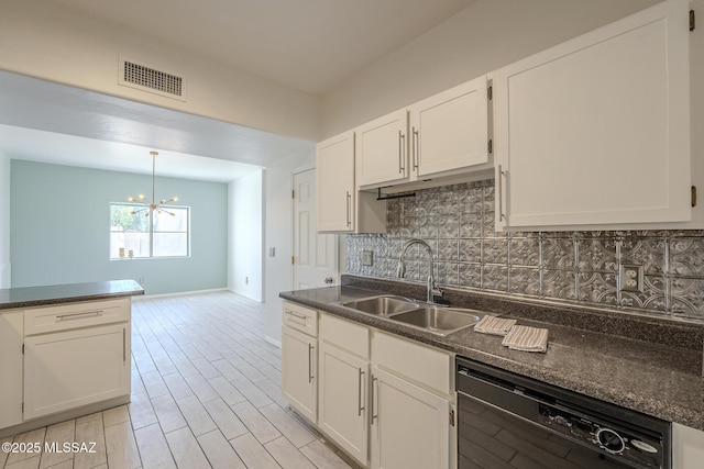 kitchen with a sink, visible vents, black dishwasher, backsplash, and dark countertops