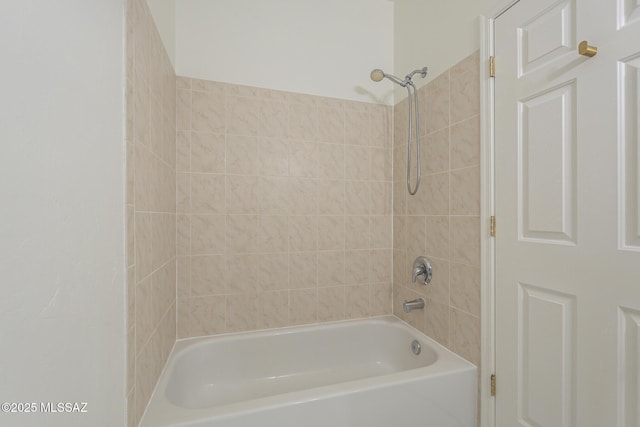 bathroom with shower / washtub combination