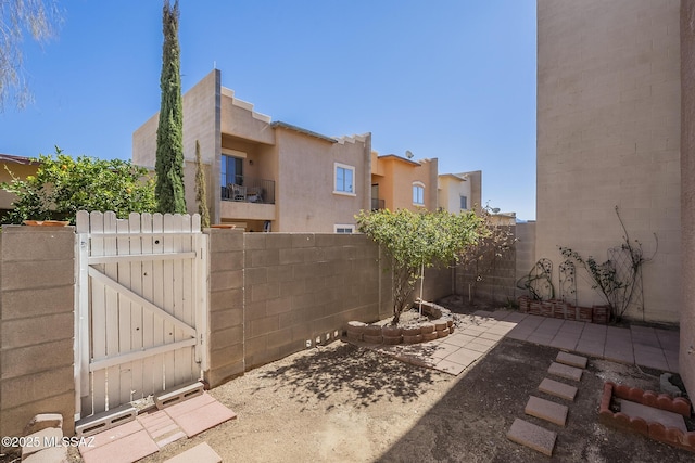 view of patio / terrace featuring a gate and fence