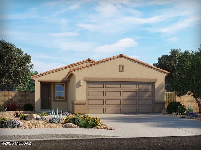 mediterranean / spanish home with driveway, a garage, a tiled roof, fence, and stucco siding