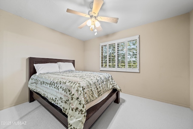 bedroom with light carpet and ceiling fan