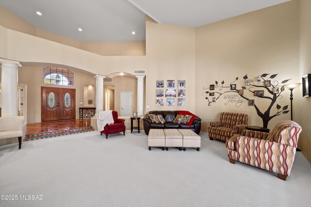 kitchen with built in appliances, sink, light stone counters, a healthy amount of sunlight, and a breakfast bar area