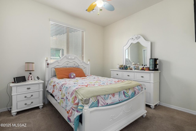 bedroom with ceiling fan and dark colored carpet