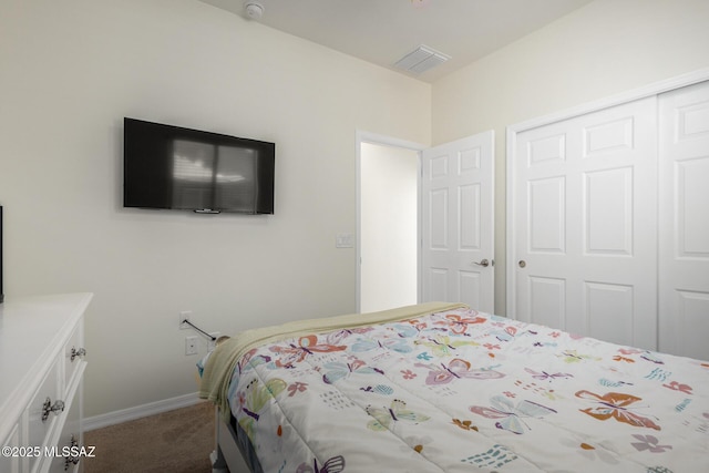 carpeted bedroom with a closet