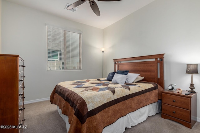 bedroom featuring ceiling fan and light carpet