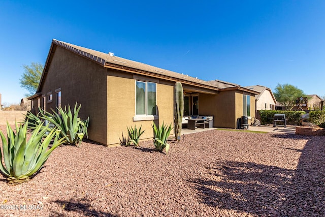 rear view of house featuring a patio area