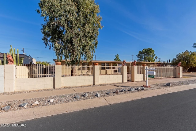 ranch-style house with a fenced front yard