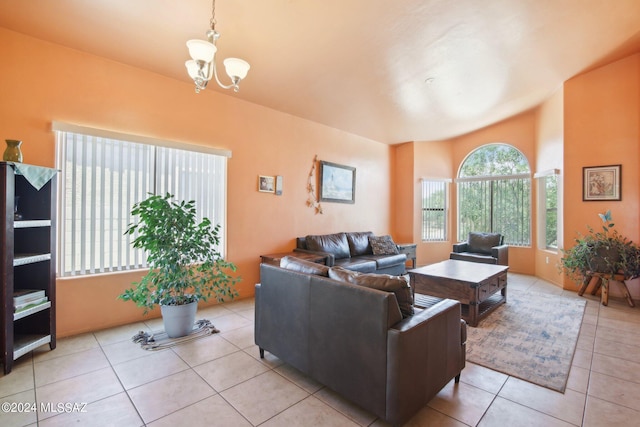 living area featuring light tile patterned floors and an inviting chandelier