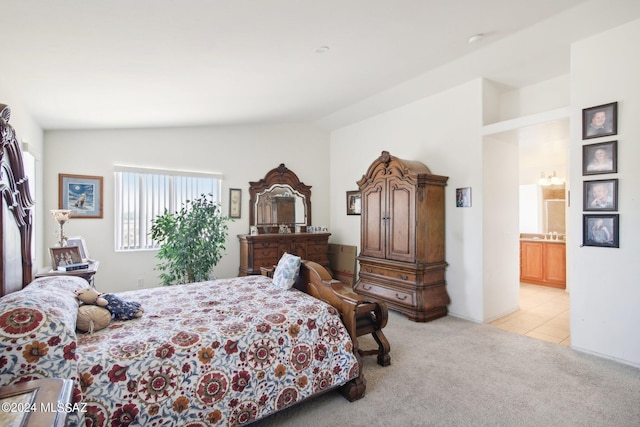 bedroom featuring light carpet and lofted ceiling