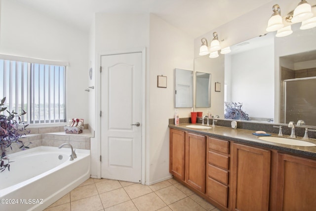 full bath with double vanity, tile patterned flooring, a sink, and a bath