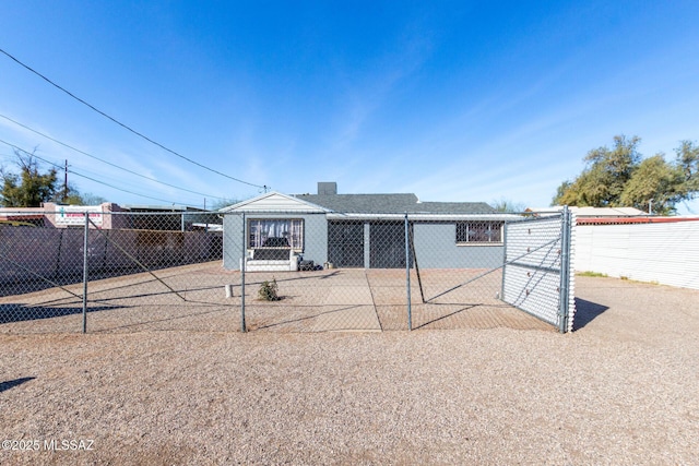 back of house featuring fence