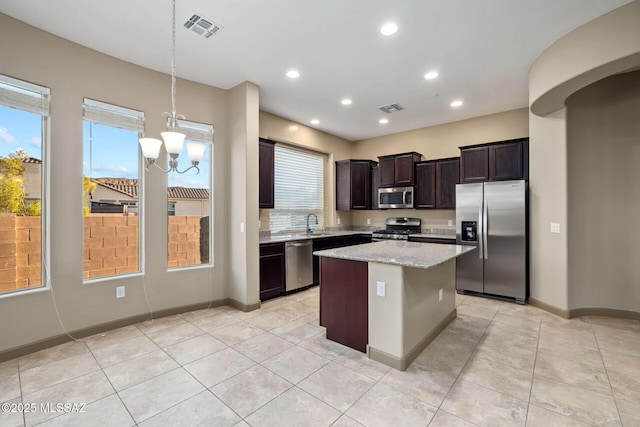 kitchen featuring visible vents, recessed lighting, appliances with stainless steel finishes, and a center island