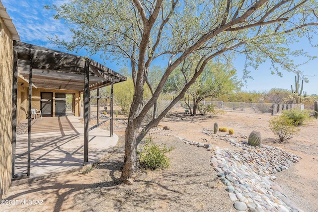 view of yard featuring a patio and fence