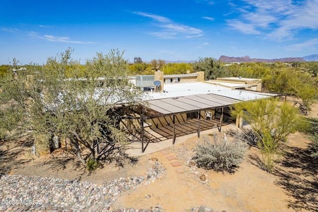 birds eye view of property featuring a mountain view