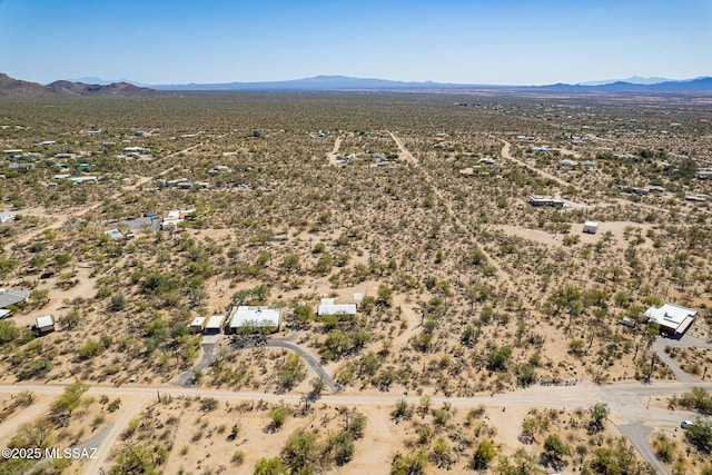 bird's eye view with a mountain view and a desert view