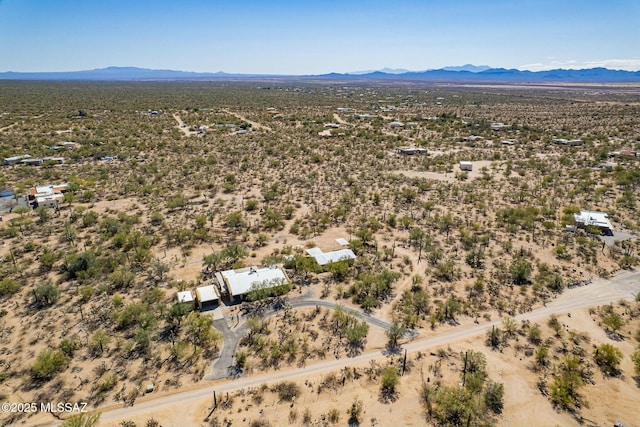 aerial view with a mountain view and a desert view