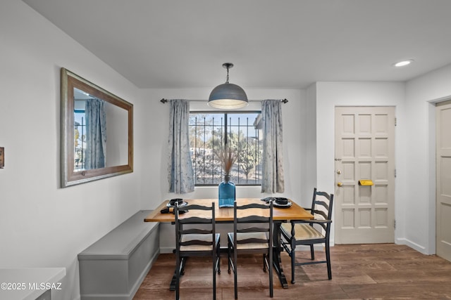 235 N Tucson Blvd, Tucson, AZ 85716 - dining room featuring baseboards and wood finished floors