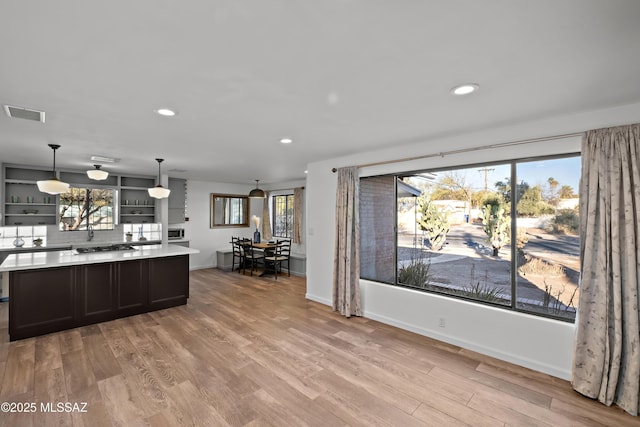 235 N Tucson Blvd, Tucson, AZ 85716 - kitchen featuring visible vents, open shelves, light countertops, recessed lighting, and light wood-style flooring