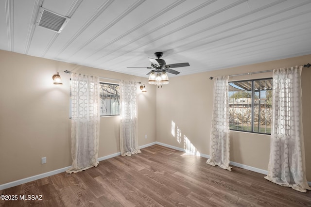 235 N Tucson Blvd, Tucson, AZ 85716 - empty room with visible vents, baseboards, and wood finished floors