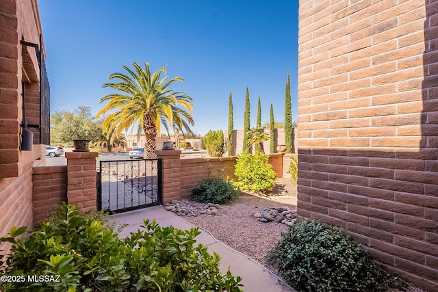 view of gate featuring fence