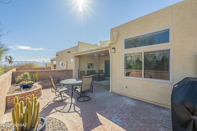 view of patio with a fenced backyard, outdoor dining area, and area for grilling