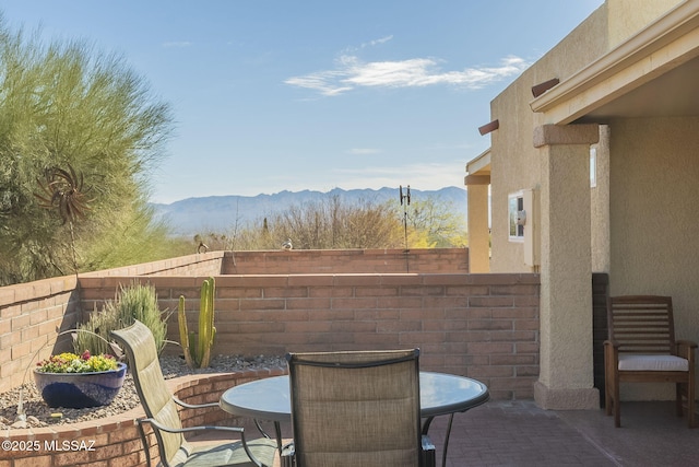 view of patio with a fenced backyard and a mountain view