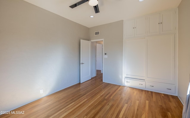 unfurnished bedroom with light wood finished floors, recessed lighting, visible vents, and a ceiling fan