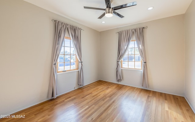 empty room with recessed lighting, a ceiling fan, and light wood-style floors