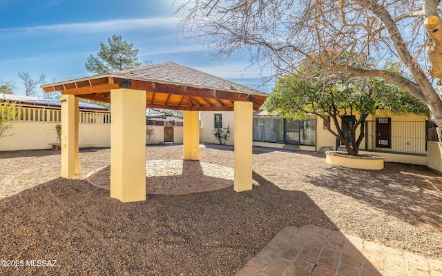 view of patio featuring a gazebo and a fenced backyard