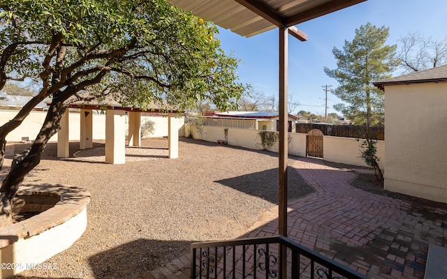 view of patio / terrace featuring a fenced backyard and a gate