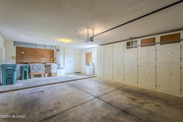 garage with water heater, washer / dryer, and a garage door opener