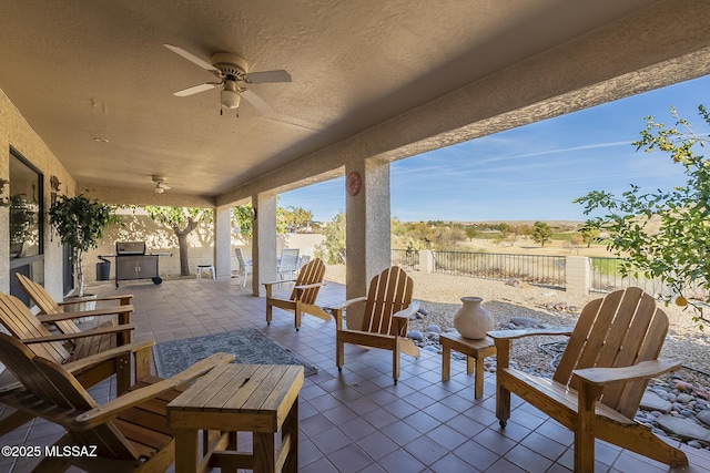 view of patio featuring a ceiling fan and a fenced backyard