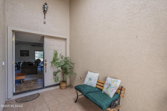 doorway to property featuring stucco siding