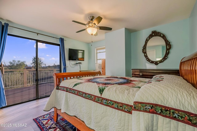 bedroom featuring access to exterior, ceiling fan, and wood finished floors