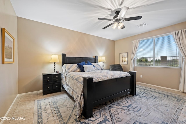 tiled bedroom with ceiling fan