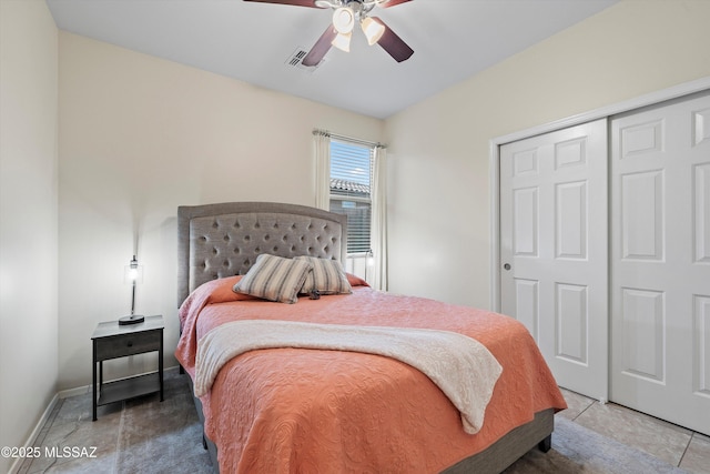 bedroom featuring a closet, ceiling fan, and tile patterned flooring