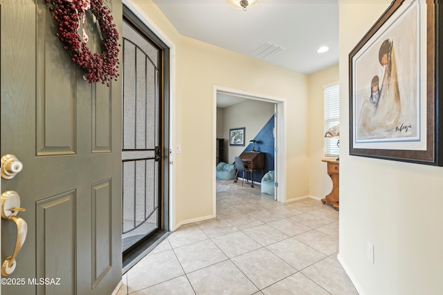 entryway featuring light tile patterned floors